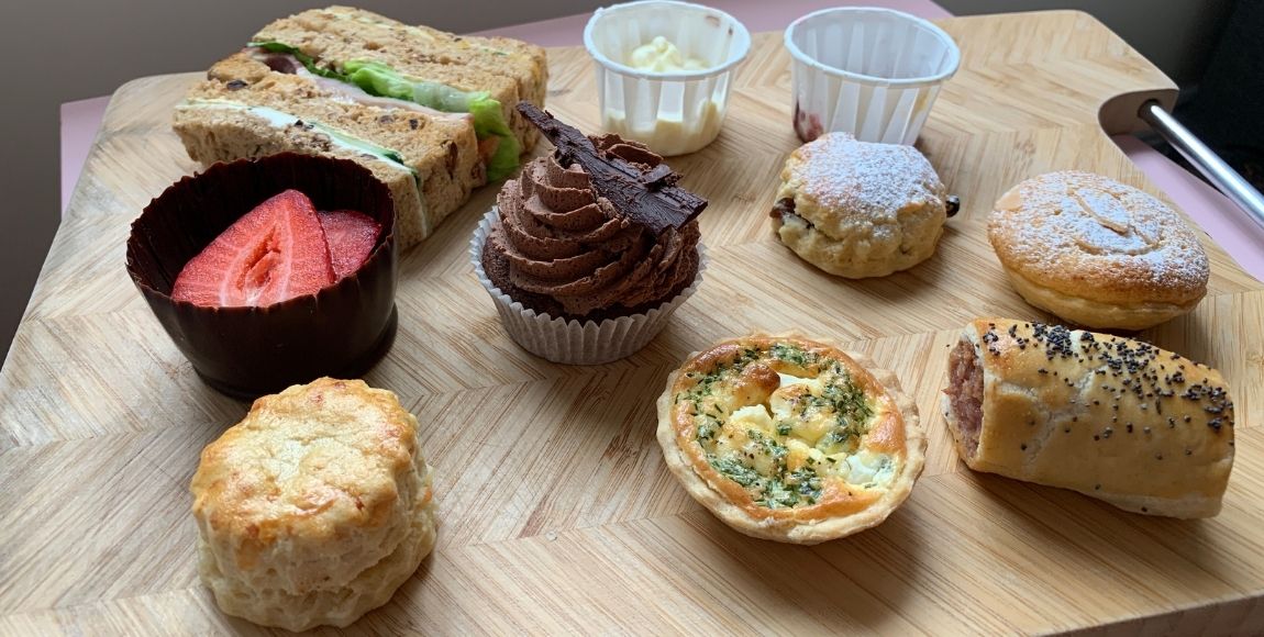 Suffolk afternoon tea by Country Cuisine on a wooden board